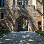 steel-gate-of-brown-brick-building-159490 crop